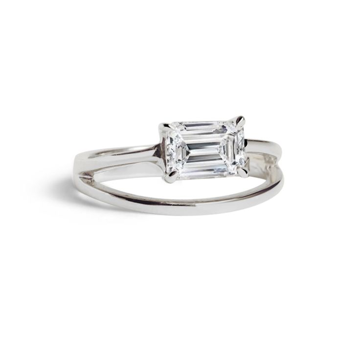 The Emerald Sunset Ring was a contemporary take on a classic solitaire. The arrangement of the emerald cut diamond set on its side is a harmonious balance between the stone and the airy delicate setting. Designed with a play on negative space, the band splits to create an illusion of two bands with one floating above the other when worn. 

Pairs with our Duét Band, Open Thread Band and Infinity Thread Band. 

Available in Yellow Gold, White Gold, Rose Gold

Handcrafted in Los Angeles, California Sunset Ring, Emerald Cut Diamond, Emerald Cut Diamonds, Negative Space, Contemporary Jewelry, Emerald Cut, Emerald, Thread, White Gold