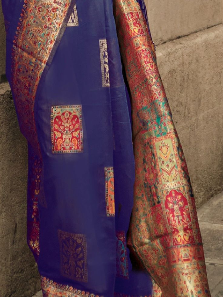 Introducing the "ravishing blue zari woven silk wedding wear saree with blouse" from Ethnic Plus! This exquisite silk saree is the perfect style statement for a traditional look. Made with high-quality silk material in a stunning blue color, this saree features intricate zari weaving work that adds a touch of elegance and charm.
Whether you're attending a wedding, cocktail reception, festival, or any other special occasion, this saree will make you stand out in the crowd. Its timeless design and Elegant Blue Pre-draped Saree For Puja, Blue Jamawar Pre-draped Saree With Zari Weaving, Blue Wedding Pre-draped Saree With Zari Weaving, Royal Blue Saree With Zari Weaving For Diwali, Royal Blue Saree For Puja And Diwali, Royal Blue Saree For Diwali Puja, Blue Saree With Zari Weaving, Blue Art Silk Saree With Zari Weaving, Blue Banarasi Silk Saree With Unstitched Blouse