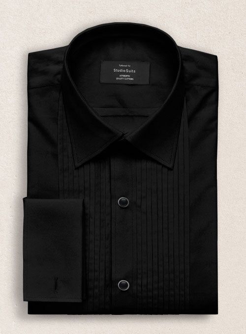 Create a timeless and elegant appearance. Our Pleated Black Tuxedo Shirt is a sophisticated choice for dress suits and tuxedos. Cut from the finest cotton, the shirt has a subtle luster and feel. Pleated bibs feature vertical pleats that run up both sides of the button placket and are a traditional detail on tuxedo shi Classic Tailored Top For Party, Classic Party Tops With Spread Collar, Luxury Cotton Formal Tops, Elegant Slim Fit Dress Shirt For Party, Elegant Long Sleeve Tuxedo For Black-tie Events, Elegant Slim Fit Party Dress Shirt, Fitted Tuxedo Shirt For Formal Occasions, Formal Fitted Tuxedo Shirt, Tailored Timeless Formal Tops