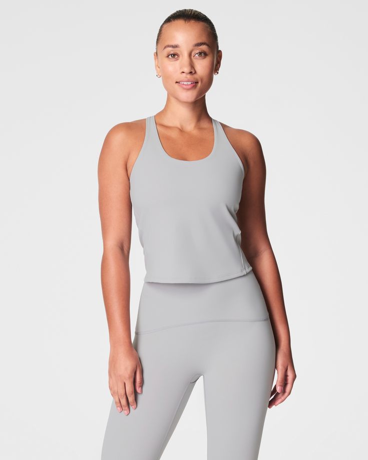 This contour crossback tank top features a built-in shelf bra with an adjustable band for a custom fit. An ideal style for distraction-free downward dogs, it hits at the hip and fits close to the body. | Spanx Women's Get Moving Contour Crossback Shelf Tank Top Downward Dog, Get Moving, Shelf Bra, Custom Fit, Built In, Tank Top, Tank Tops, Bra, Band