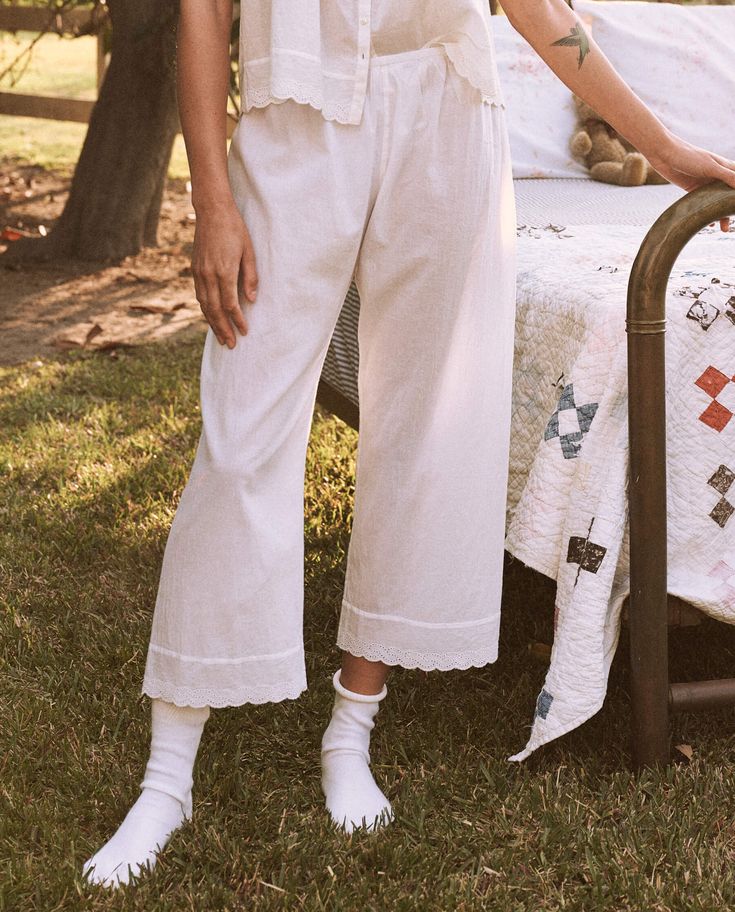 Perfect for slow mornings at home, The Eyelet Easy Sleep Pant. is the epitome of elevated comfort. Crafted from supersoft and lightweight cotton voile fabric, the pant is adorned with a Victorian-inspired eyelet lace trim and finished with a delicate scalloped edge. Designed for an easy pull-on fit with an elasticated waistband, these pants pair back to the matching The Eyelet Tank. or your favorite tee for a relaxed yet coordinated look. 100% Cotton Machine Wash Cold, Lay Flat to Dry Import Cotton Sleepwear Long Pants For Spring, Comfortable Cotton Sleep Pants, Spring Cotton Sleepwear With Wide Legs, Cotton Wide Leg Sleepwear For Lounging, Spring Wide Leg Cotton Sleepwear, Cotton Wide-leg Sleepwear For Lounging, Spring Wide-leg Cotton Sleepwear, Wide Leg Cotton Sleepwear For Spring, Cotton Wide Leg Sleepwear