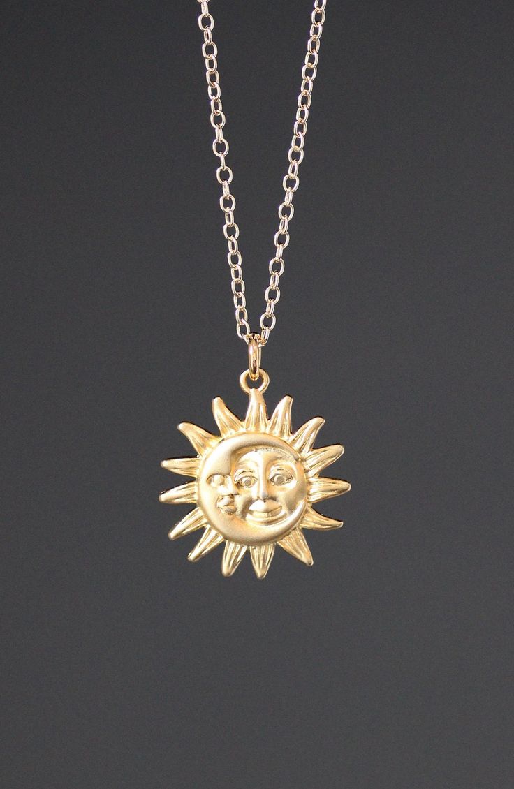 "This beautifully detailed 18k matte gold vermeil Sun and Moon charm dangles from a 14k gold filled chain. The chain is adjustable and can be worn close to the neck at 16\" or a little longer at 18\". It is finished with a gold lobster clasp. Please send a message if a longer chain is desired. Wear this necklace by itself or as a layering piece. Gold Sun and Moon pendant: 19mm Total length of charm: 1\" Gold chain: 1.5mm As the owner, maker, designer, and curator of this shop, I take great pride Gold Moon-shaped Engraved Necklace, 14k Yellow Gold Filled Moon-shaped Jewelry, 14k Gold Filled Yellow Gold Moon Jewelry, 14k Gold-filled Moon Shaped Yellow Gold Jewelry, 14k Gold-filled Yellow Gold Moon Jewelry, 14k Gold Jewelry With Moon Phase Detail, Celestial Yellow Gold Charm Necklace With Adjustable Chain, Celestial Charm Necklace In Yellow Gold With Delicate Chain, Yellow Gold Moon-shaped Jewelry With Delicate Chain