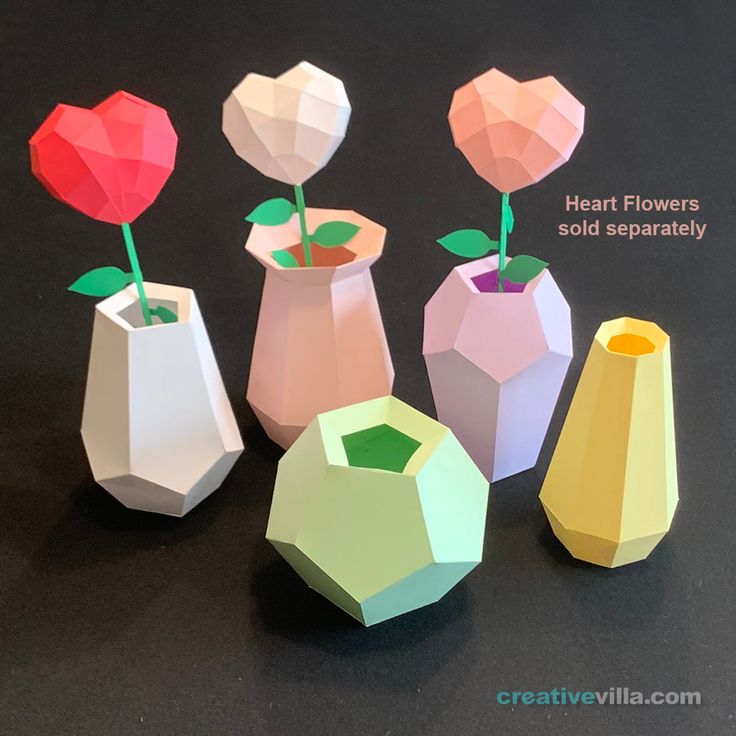 four small vases with flowers in them on a table next to each other and the words heart flowers sold separately