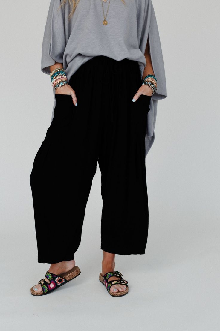 Elevate your boho wardrobe with the Blissful Drifter Pants, so cozy and cool with their trendy wide legs and comfortable fit, you'll feel stylish and confident in any setting! Whether you pair them with your favorite tee or a cozy sweater, these pants are a versatile addition because they feature: Comfortable, breezy, solid linen fabric Loose and slouchy bottoms silhouette High - rise elastic drawstring waistband Statement patch pocket details along the side with pleated details along the bottom Fall Harem Pants For Loungewear, Straight Leg, Fall Straight Leg Harem Pants For Loungewear, Hippie Wide-leg Pants For Fall, Wide-leg Rayon Harem Pants For Loungewear, Rayon Wide-leg Harem Pants For Loungewear, Hippie Wide Leg Pants For Fall, Bohemian Straight Leg Pants For Fall, Wide-leg Harem Pants For Loungewear In Fall, Bohemian Loungewear Bottoms With Elastic Waistband