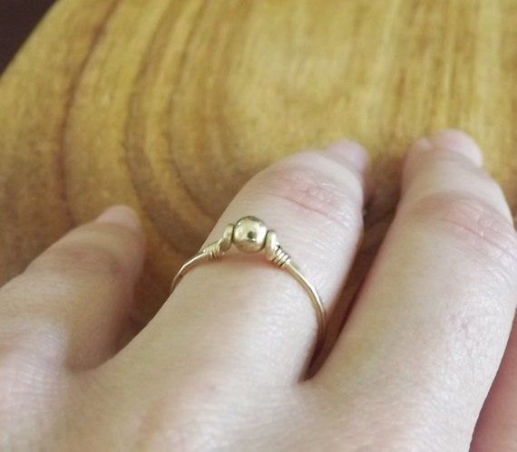 The sweetest ring for any finger. I forge and hammer the sterling and connect to a tiny shiny gold filled bead. Choose from sizes 4-10 and leave message in comment box at checkout. Try stacking two or three together for a beautiful look! ==You can view the whole ring collection== http://www.etsy.com/shop/BellatrinaJewelry?section_id=11006644 ** Follow us for updates, contests, and promos. :) www.facebook.com/BellatrinaJewels www.twitter.com/BellatrinaJewel Dainty Hand Forged Gold Stackable Rings, Simple Adjustable Round Band Jewelry, Adjustable Hand Forged Gold Stackable Rings, Hand Forged Adjustable Round Band Ring, Adjustable Hand Forged Round Band Ring, Dainty Adjustable Hand Forged Stackable Rings, Dainty Hand Forged Adjustable Stackable Rings, Adjustable Yellow Gold Ring Nickel Free, Adjustable Yellow Gold Nickel Free Ring