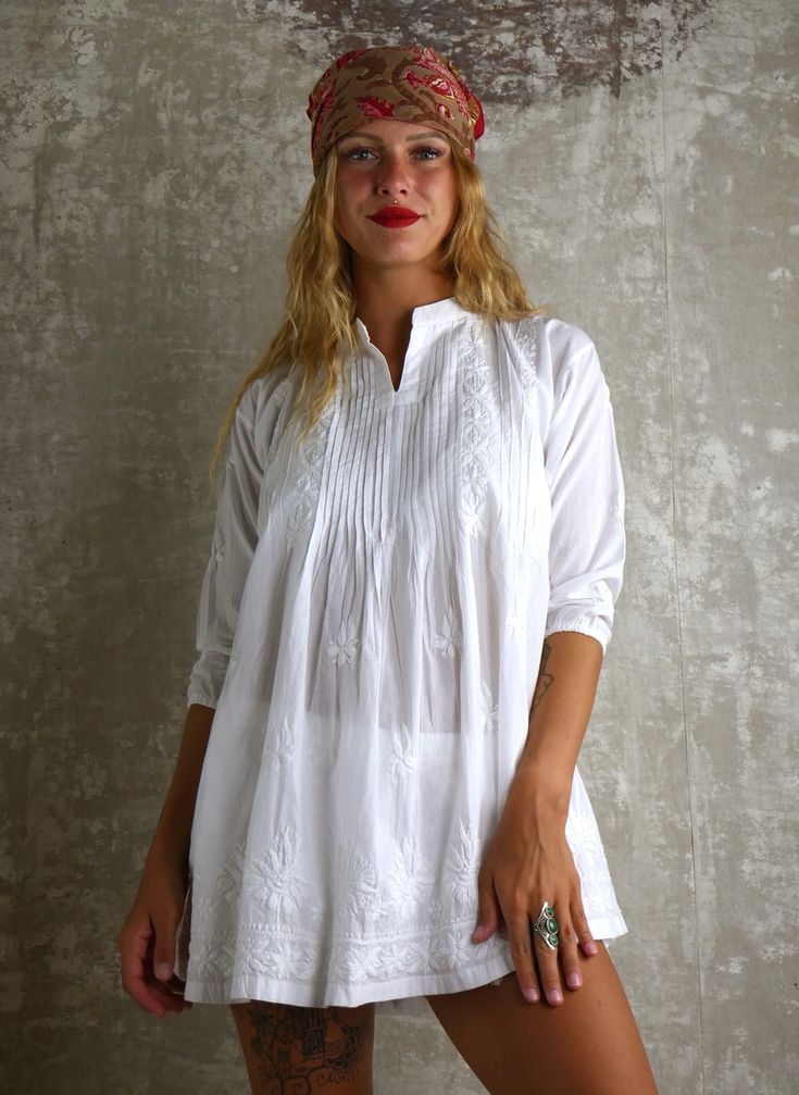 COMFORTABLE white beach or city dress with handmade cotton embroidery is very easy to wear. this super soft cotton is very pleasant in all seasons! for a beach outing with a swimsuit, by the pool, in the evening for a restaurant with jeans or shorts! .. under pullover also... VERSATILE soft 100% cotton white dress is very popular tunic for lazy days in your house, to go shopping or even for a party.. the embroidery is incredible. it is an elegant piece, which requires a unique know-how. TIMELESS classic casual women dresses. All season cotton tunic with handmade embroidery for beach or city wear, elegant and simple, to wear in all circumstances. This is an ancestral Indian HANDMADE technique. Model size: 170 cm CHOOSE YOUR SIZE : 34: Bust size: 80 CM Sleeve: 34 CM Length: 74 CM Cleaning: b White Tunic With Chikankari Embroidery, White Chikankari Embroidered Tunic, White Bohemian Tunic With Chikankari Embroidery, Traditional White Summer Tunic, White Cotton Tunic Blouse, White Cotton Tunic With Floral Embroidery, White Chikankari Embroidery Summer Tunic, Cotton Embroidered Dress For Festival, Folk Style White Tunic Embroidered Dress