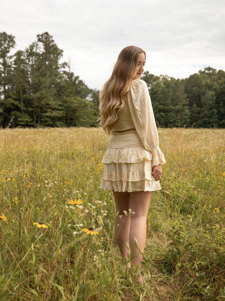 This off shoulder crop top and skirt set features a ruched smocked body and drawstring bust. The model is wearing a size medium. Fitted Bohemian Skirt With Smocked Bodice, Ruched Tiered Skirt Smocked Dress, Fitted Beige Smocked Top With Ruffles, Crop Top And Skirt Set, Crop Top And Skirt, Top And Skirt Set, Off Shoulder Crop Top, Top And Skirt, Shoulder Crop Top