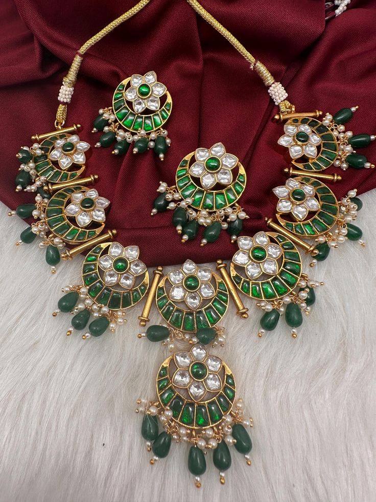 Traditional Floral Pattern  Jadau Kundan Green Necklace  Real look alike necklace. Premium quality and craftmanship. Necklace length : 16 Inches comes with adjustable back Thread (dore). Earrings length : 1.5 Inches. Push Back Ready to ship from Boston, Massachusetts. If you have any questions, please let me know. Thank You!! Bohemian Gold Bridal Necklace With Polished Beads, Bohemian Gold Kundan Necklaces, Kundan Chandbali Jewelry With Gold Beads, Kundan Necklaces With Latkans For Gifts, Festive Kundan Jewelry With Gold Beads, Bohemian Gold Necklace With Meenakari, Festive Gold Jewelry Sets With Polished Beads, Ceremonial Kundan Jewelry With Gold Beads, Green Temple Jewelry Necklaces With Latkans