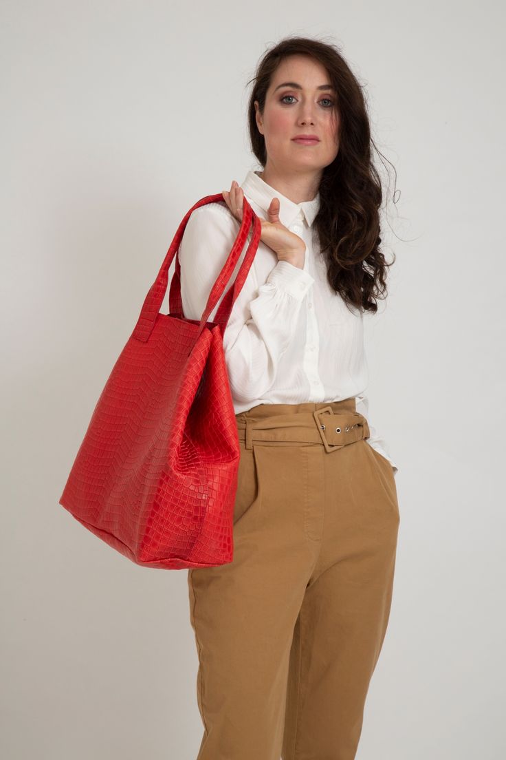 Leather tote bag XL size handmade in our atelier with an amazing croc effect leather. You can change its shape using the two closire systems for closing the bag.  With a big canvas pocket inside for the laptop. FREE SHIPPING through our Etsy shop. Available in more colors.  
#leathertote #redbag #crocbag #laptopbag #workbag #womenbag Red Rectangular Bag With Large Capacity, Large Capacity Red Rectangular Bag, Red Rectangular Bucket Bag With Large Capacity, Red Large Capacity Rectangular Bucket Bag, Red Double Handle Bag With Large Capacity, Red Box Bag With Large Capacity And Double Handle, Red Box Bag With Double Handle And Large Capacity, Red Rectangular Large Capacity Bucket Bag, Casual Red Shoulder Box Bag