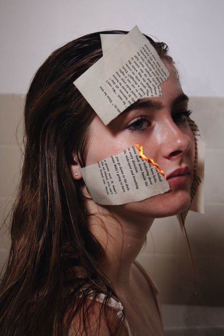 a woman with paper taped to her face