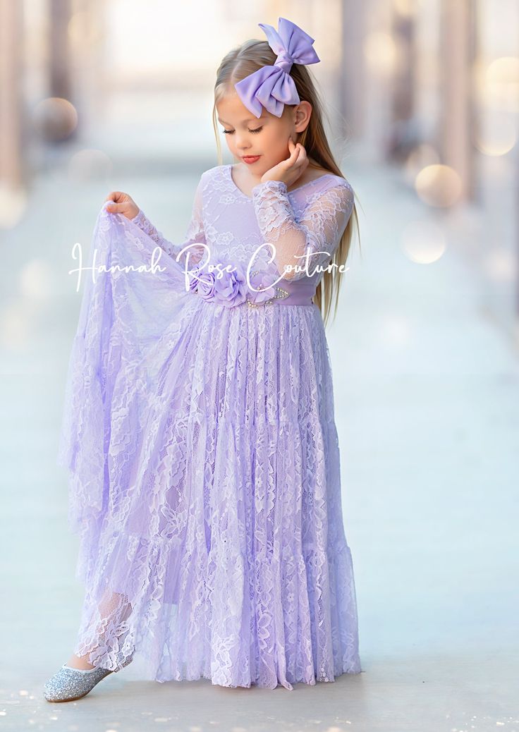 Dress your little one in the most enchanting Lavender Lace flower girl dress to compliment your whimsical wedding theme! Soft lavender lace, long flowing skirt, perfect for Romantic, Disney, Classic Fairytale weddings. Ideal for birthdays & portraits. How to Order: Dresses are true to size. Please measure to ensure best fit. *Select your preferred sash style and then leave the sash color in the cart notes at checkout. Additional Options: We offer an array of adorable wedding bridal sashes and br Princess Style Lace Dress For Dress-up, Fitted Lace Dress With Lace Sleeves For Dress-up, First Communion Spring Dress With Lace Trim, Spring Princess Dress With Fitted Bodice For Bridesmaid, Spring Dress-up Gown With Fitted Bodice, Lace Princess Dress With Fitted Bodice For Bridesmaids, Spring Wedding Princess Dress With Lace Patchwork, Spring Wedding Princess Dress With Lace Bodice, Purple Lace Dresses With Ruffles