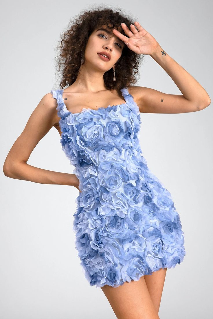 A whimsical masterpiece that captures the essence of romance and charm. Crafted with meticulous attention to detail, this dress is adorned with intricate 3D floral embellishments that cascade delicately across the fabric. The vibrant blue hue adds a touch of boldness and sophistication, making this dress perfect for any special occasion. The mini length exudes youthful flair, while the figure-flattering silhouette ensures a stunning look that turns heads wherever you go. Whether you're attending a garden party, a summer soirée, or a romantic date night, the 3D Floral Mini Dress promises to make a statement. Pair it with your favorite heels and accessories to complete the look, and embrace your inner elegance with this enchanting ensemble. Handmade customization Fabric composition: 90% poly Blue Floral Applique Dress For Prom, Blue Floral Applique Prom Dress, Blue Floral Applique Wedding Dress, Blue Wedding Dress With Floral Applique, Light Blue Floral Applique Summer Dress, Elegant Light Blue Dress With Floral Applique, Blue Floral Embroidered Prom Dress, Blue Fitted Dress With Floral Applique, Elegant Floral Applique Mini Dress For Garden Party