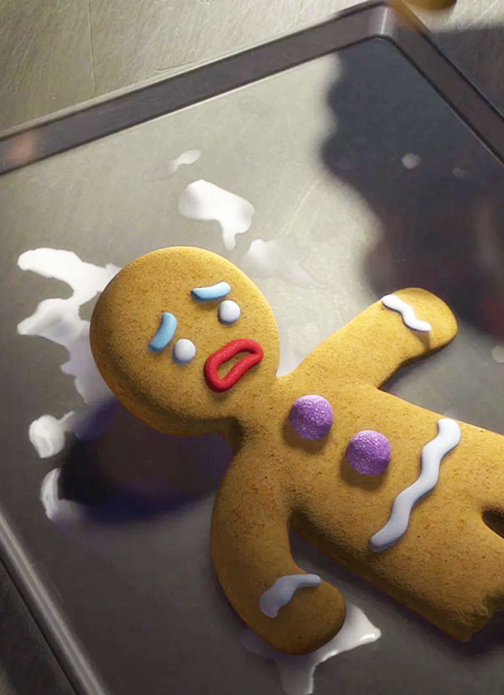 there is a ginger man made out of cookie dough on the table with white icing and sprinkles