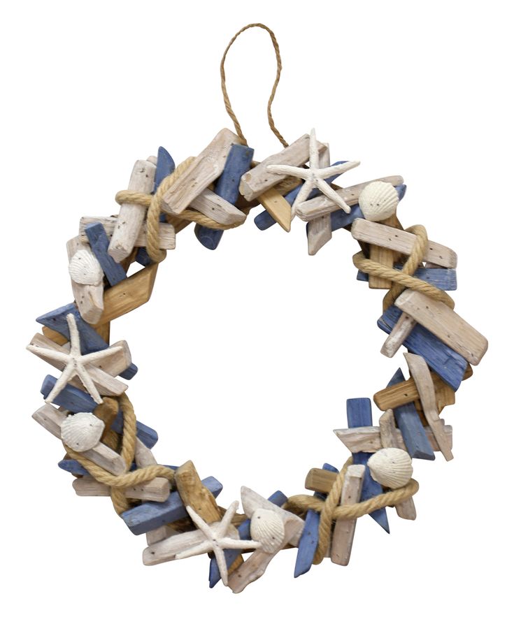 a blue and white wooden wreath with starfishs, seashells and sand dollars