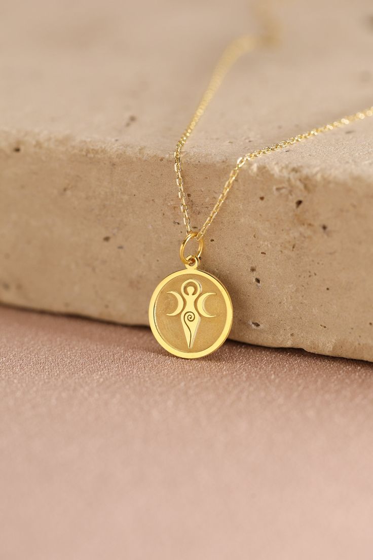 Gold Gaia Pendant - Gaia Gold Necklace ● Material of pendant: Solid Gold 14k ( REAL GOLD ) ● Metal Stamp: 14k ( REAL GOLD ) ● The pendant is available in 5 sizes: - 12,7 mm / 0.5 inches (Diameter) - 14,0 mm / 0,55 inches ( Diameter ) In the photos - 15,3 mm / 0.6 inches ( Diameter ) - 16,5 mm / 0,65 inches ( Diameter ) - 19,1 mm / 0,75 inches ( Diameter ) ( In the photos the size is 14mm / 0.55 inches Diameter ) ( Jump Ring inner diameter: 4 mm ) ● Material of chain: Solid gold 14k ( REAL GOLD ) Gold Engraved Goddess Necklaces, Gold Engraved Goddess Style Necklaces, Gold Engraved Goddess Necklace, Gold Engraved Goddess Jewelry, Gold Engraved Goddess Style Jewelry, Gold Goddess-style Engraved Jewelry, Gold Goddess Style Engraved Jewelry, Gold Goddess Style Engraved Necklace, Goddess Style Engraved Pendant Jewelry