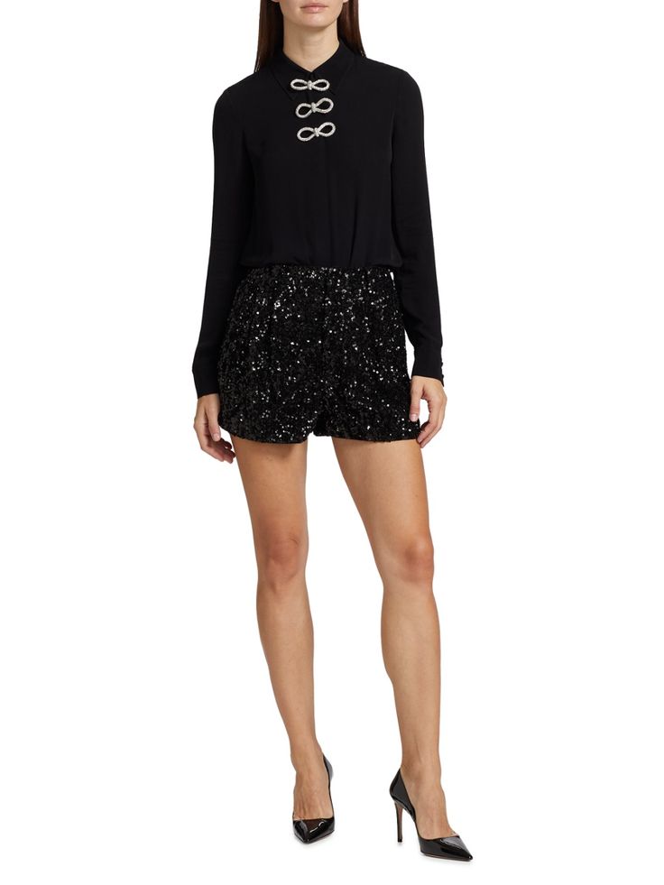 Alice + Olivia's Conry sequined shorts are designed with a cuffed hem. Belt loops Side-seam pockets Concealed zip fly, hook-and-bar closure 100% polyester Lining 1: 100% polyester Lining 2: 95% polyester/5% elastane Dry clean Imported SIZE  FIT Rise: about 12.5 Leg opening: about 25.5 Model measurements: 5'10 tall Model is wearing a US size 4 ABOUT THE BRAND Statement Tops, Eclectic Prints, Stacey Bendet, Sequin Shorts, Cuffed Shorts, Feminine Aesthetic, Tall Model, Alice Olivia, Model Measurements