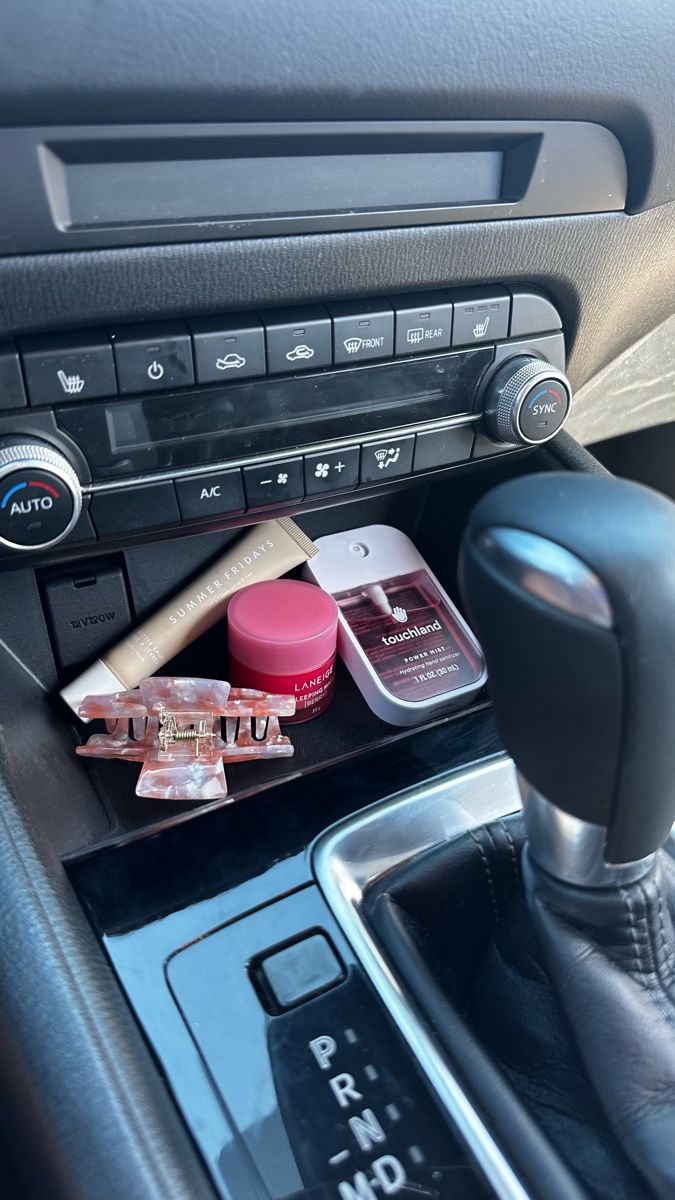 Pink beauty products, lip products, touchland hand sanitizer, laneige lip mask pink, summer fridays, car essentials, clean car, road trip, black car, clean girl car aesthetic Girly Car Accessories, Car Deco, Girly Car, Car Essentials, Car Goals, Cute Car Accessories, Foto Tips, Car Interior Decor, First Car