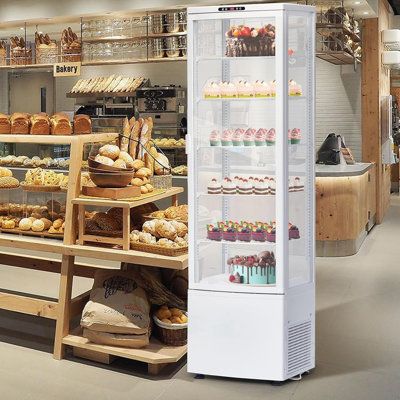 a bakery filled with lots of different types of breads and pastries on display