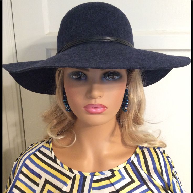 Wear This New Elegant Navy Blue Hat To Add To Your Sophisticated Look. This Hat Is A Great Accessory To Complete Your Put Together Fashionable Style. It Goes Well With All Black Or Or A Blue Or Red Top/Dress. Make Sure You Wear Your Over The Knee Boots To Really Look Like The Model You Are. Earrings Not Included. Elegant Blue Wide Brim Fedora, Elegant Blue Fedora With Short Brim, Blue Spring Felt Hat With Curved Brim, Navy Hat For Spring, Elegant Navy Wide Brim Hat, Elegant Blue Spring Fedora, Elegant Blue Fedora For Spring, Chic Blue Fitted Hat, Chic Fitted Blue Hat