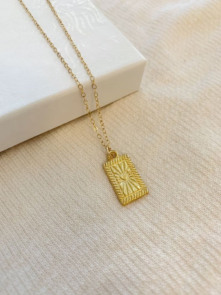 Heart jewelry, heart necklace, rectangle necklace, gold tag necklace, gold filled necklace, v day jewelry, gifts for her, 14k gold necklace, tarot necklace, dainty gold necklace, layering necklace Gold Rectangle Necklace, Rectangular Gold Plated Jewelry For Gifts, Rectangular Gold Plated Jewelry Gift, Gold Rectangular Necklaces As Gift For Her, Rectangular Gold Necklace Gift For Her, Tarnish Resistant Rectangular Charm Necklace Gift, Gold Charm Necklace With Rectangular Pendant For Gift, Gold Rectangular Charm Necklace Gift, Dainty Rectangular Jewelry Gift