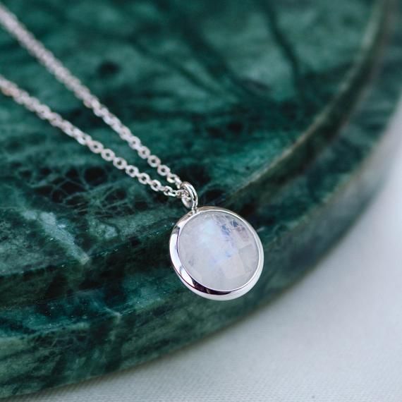 Dainty Moonstone necklace for women in 14K solid gold. A dainty gold birthstone necklace ideal for birthday gift or for Christmas. Genuine rainbow moonstone pendant on 14K solid gold chain with a spring clasp. Moonstone is also June birthstone.  100% handcrafted with love! D E T A I L S● Metal: 14K solid gold, 14K white gold or 14K rose gold● Gemstone: Moonstone, round briolette cut ● Stone Diameter: 10mm (0.4in)● Length: 39cm (15.5in) to 47cm (18.5)H O W ∙ T O ∙ O R D E RChoose from the drop do Delicate Moonstone Round Pendant Necklace, Moonstone Round Clavicle Chain Necklace, Moonstone Clavicle Chain Round Necklace, Delicate Round Moonstone Pendant Necklace, Moonstone Clavicle Chain Necklace, Round Moonstone Clavicle Chain Necklace, Dainty Round Necklace For May Birthstone, Dainty May Birthstone Round Necklace, Dainty May Birthstone Round Necklaces