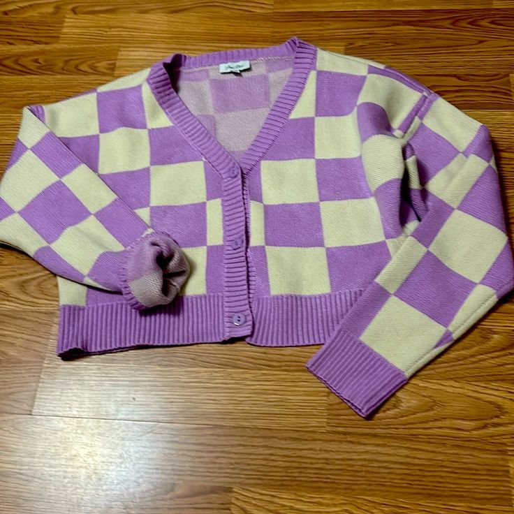 Petal Dew Cardigan For The Classic Girl In You Size Medium, Three Buttons Down The Front, Purple And Cream Checkered Hundred Percent Polyester Like New Without Tags Worn Once Trendy Purple V-neck Cardigan, Trendy Purple Long Sleeve Cardigan, Purple V-neck Cardigan For Winter, Purple V-neck Fall Cardigan, Casual Lavender Spring Cardigan, Trendy Purple V-neck Outerwear, Trendy Purple V-neck Sweater, Trendy Purple Cotton Cardigan, Purple Long Sleeve Casual Cardigan