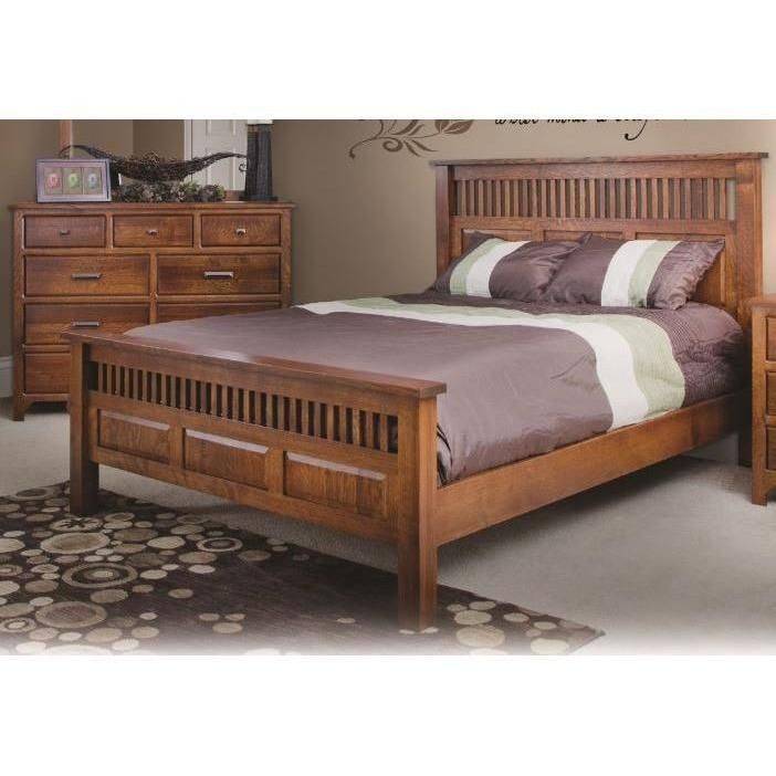 a wooden bed sitting next to a dresser and night stand in a room with carpeted flooring