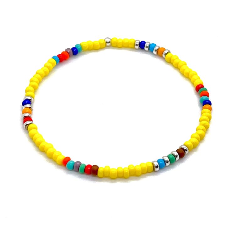 Men's summer bracelet with yellow beads and bright accent beads in assorted colors. Simple stretch bracelet. Silver Beaded Stretch Bracelet For The Beach, Yellow Heishi Beaded Bracelets, Yellow Heishi Bead Bracelets, Multicolor Tiny Beads Bracelets For Beach Season, Multicolor Tiny Beads Bracelet For Beach Season, Yellow Beaded Bracelets For Vacation, Casual Beaded Bracelets With Tiny Beads For Beach Season, Colorful Beaded Yellow Bracelets For Vacation, Adjustable Polished Bead Bracelets For Beach