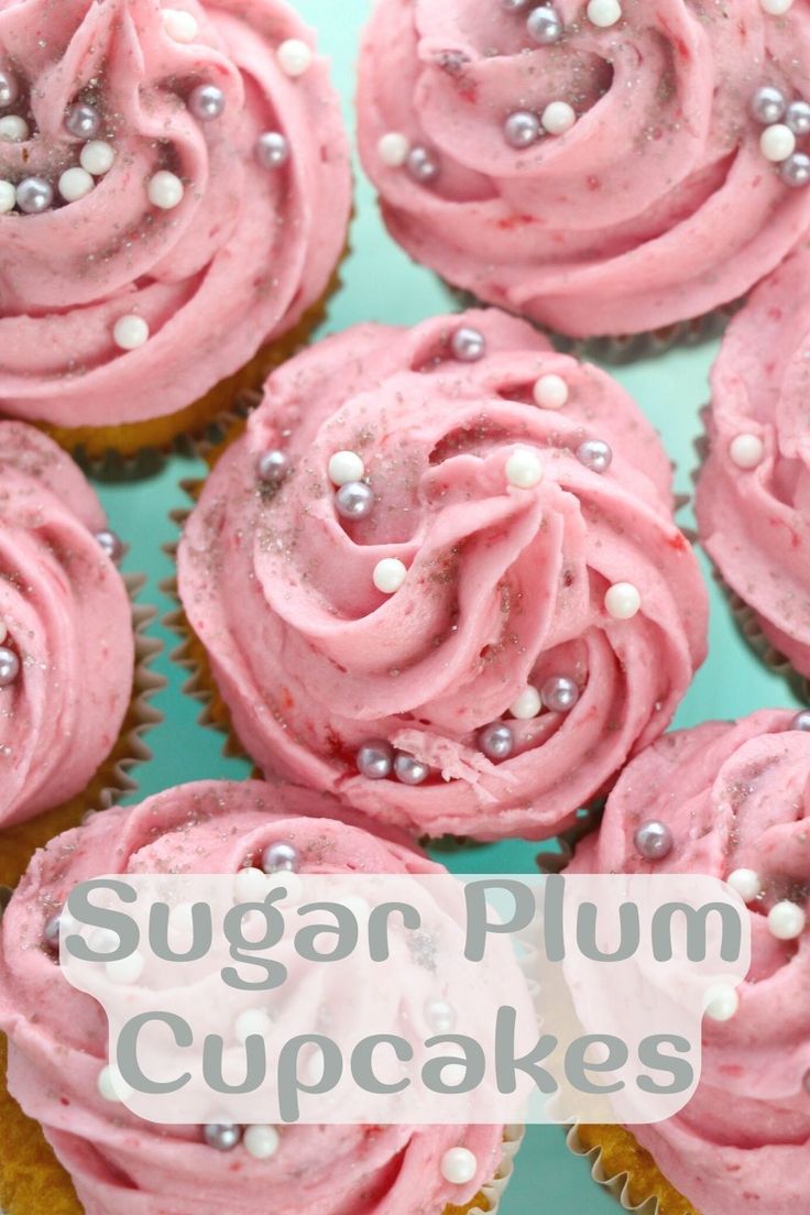 cupcakes with pink frosting and white sprinkles