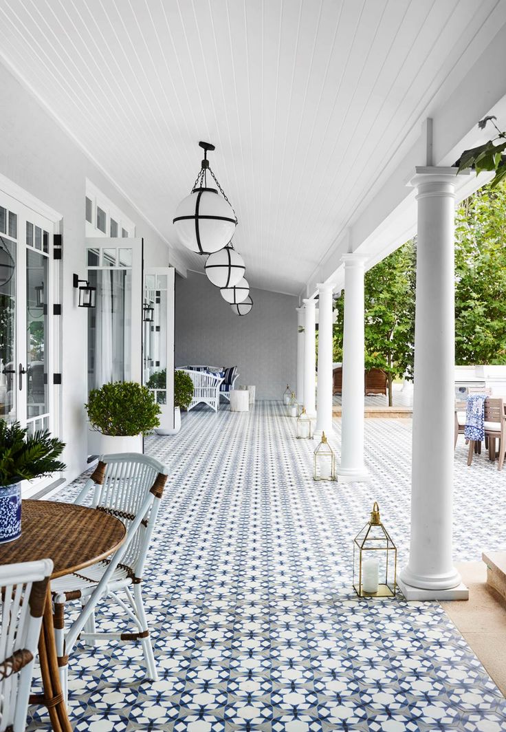 an outdoor patio with blue and white tile