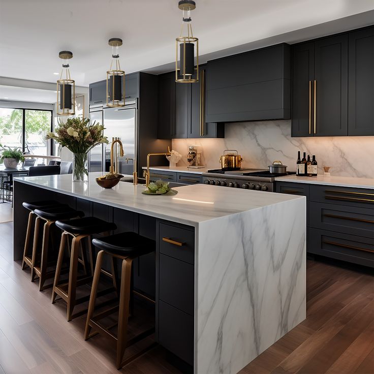 a large kitchen with marble counter tops and black cabinets, along with bar stools