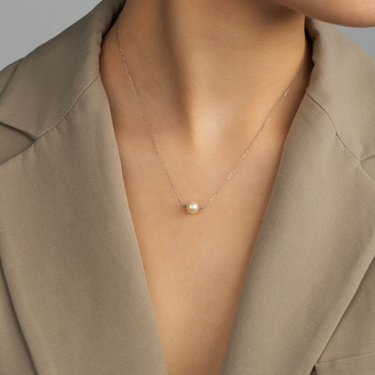 "Delicately dainty and elegant, this 14k gold solitaire pearl necklace is simple, yet sophisticated. A classic pearl floating on the 14k real gold chain will be your favorite piece of jewelry to wear every day.  F E A T U R E S    * Gold Carat: 14K  * Choice of Gold Color: Yellow Gold, Rose Gold, White Gold  * Pendant Diameter: 7,50 mm /  0.30 in * Length Options: 14\", 16\", 18\", 20\"   * Ready to Ship in 1-3 Business Days  * 1-Year Warranty  * Free Shipping  * Free returns within 30 days from Elegant Everyday Akoya Pearl Necklace, Elegant Everyday White Gold Pearl Necklace, Classic Sterling Silver Pearl Necklace For Everyday, Elegant Rose Gold Solitaire Necklace For Everyday Wear, Classic Pearl Necklace With Delicate Chain For Formal Occasions, Minimalist Akoya Pearl Round Necklace, Elegant White Gold Pearl Necklace With Delicate Chain, Elegant Everyday 14k Gold Pearl Necklace, Minimalist Akoya Pearl Necklace