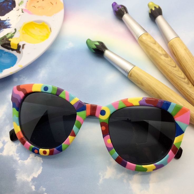 I painted the front of the sunglasses with a whimsical rainbow design! The sunglasses have UV 400 protection. Shop my store: www.etsy.com/shop/MyCraftyCollectibles ALL SALES ARE FINAL - NO REFUNDS OR EXCHANGES. Thank you! Photo decorations are not included. Fun Cat Eye Plastic Sunglasses, Fun Plastic Cat Eye Sunglasses, Rainbow Sunglasses With Uv Protection For Summer, Fun Cat Eye Sunglasses With Tinted Lenses, Trendy Rainbow Sunglasses With Gradient Lenses, Multicolor Mirrored Plastic Sunglasses, Multicolor Mirrored Lenses Plastic Sunglasses, Trendy Multicolor Plastic Sunglasses, Fun Cat Eye Sunglasses With Uv Protection