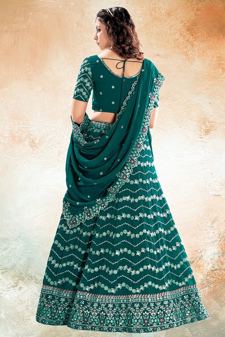 Dazzle the crowd in this exquisite designer lehenga, crafted from luxurious Art Silk fabric. The intricate sequins work adds a touch of glamour, making it perfect for special occasions and functions. The stunning craftsmanship and elegant design make this lehenga a must-have for your ethnic wardrobe. Step out in style and make a statement with this stunning ensemble. Lehenga Green, Work Lehenga, Dark Green Color, Designer Lehenga, Luxury Art, Georgette Fabric, Indian Beauty Saree, Green Fabric, Silk Fabric