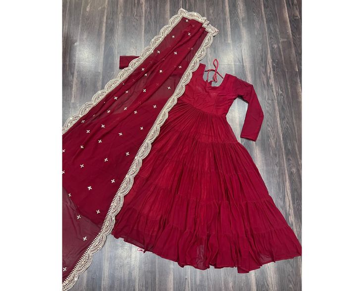 Exclusive Red Anarkali Gown Full Flair gown 15 mtr Flair Indian Long Gown 5 frill Gown Anarkali suit Party wear gown Readymade Gown  Desirable Women's Fully Flaired Gown Made With Faux Georgette Fabrics and Designer Embroidered Dupatta  GOWN   :-  FABRICS & WORK    :- Faux Georgette SIZE         :- S(36''), M(38"), L(40"), XL(42"), XXL(44")* LENGTH   :- 56 INCH FLAIR       :- 15 MTR  LINING     :- Cotton  (Full Inner Top To Bottom) SLEEVES    :- Full Sleeves NECK TYPE    :- Round Neck STITCHING Red Floor-length Ruffled Gown, Red Maxi Dress For Eid Wedding, Red Maxi Dress For Wedding And Eid, Ruffled Anarkali Set For Wedding And Festivals, Red Floor-length Gown With Cutdana, Anarkali Set With Ruffles For Wedding And Festivals, Red Anarkali Floor-length Maxi Dress, Festival Designer Anarkali Set With Ruffles, Red Anarkali Maxi Dress For Festivals