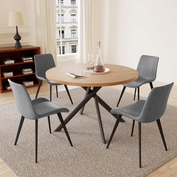 a round table with four chairs around it