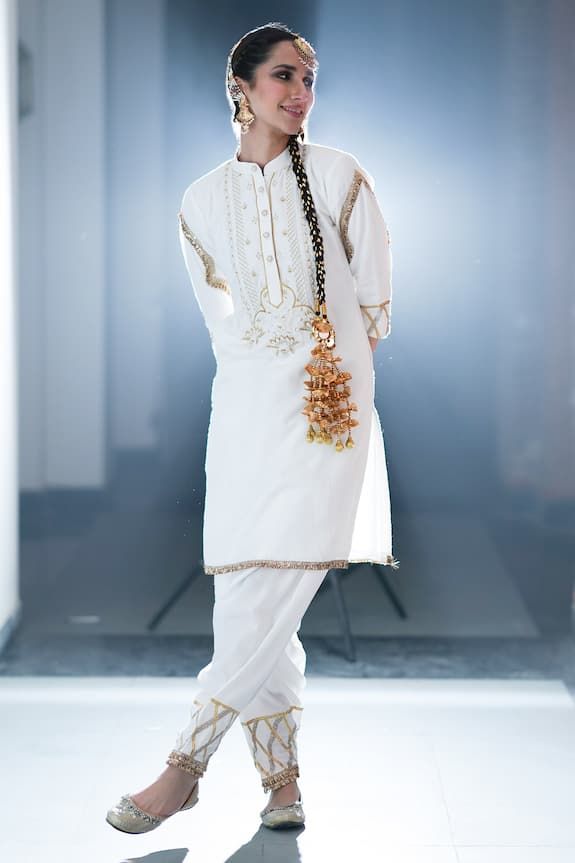 White kurta with gold, silver zari thread and bead embroidery in floral pattern on yoke. Paired with gota border embroidered salwar and potli. - Aza Fashions Gold Embroidered Dupatta For Traditional Ceremonies, White Dabka Salwar Kameez For Traditional Ceremonies, White Salwar Kameez With Dabka For Traditional Ceremonies, Traditional White Salwar Kameez With Dabka Detailing, Bollywood Style Dupatta With Gold Embroidery For Traditional Ceremonies, Traditional Festive Dupatta With Gold Embroidery, Traditional Gold Sherwani With Gota Work, Traditional Churidar With Gold Embroidery For Designer Wear, Gold Embroidered Dupatta For Traditional Ceremonies And Festivals