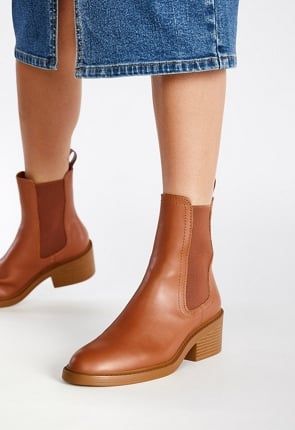 Everyday Fall Ankle Boots, Everyday Fall Boots With Reinforced Heel, Brown Round Toe Boots For Spring, Everyday Round Toe Boots For Fall, Everyday Slip-on Fall Boots, Everyday Slip-on Boots For Fall, Everyday Fall Slip-on Boots, Brown Leather Boots With Rubber Sole For Spring, Trendy Brown Boots With Rubber Sole