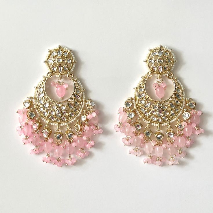 "Bollywood kundan earrings with beaded detailing and pearls add stylish flair to these gold embellished statement pieces! Length 3.5\" | Width 1.5\" Items are carefully packed and ready for gifting. All pictures are taken in natural light please allow for slight variations in color due to camera settings. Jewelry Care ✨Protect your jewelry in a closed box or pouch   ✨Wear jewelry after you have applied lotion or perfume ✨Gently buff with a soft cotton cloth  Visit our website: www.desimoon.etsy. Bollywood Pearl Drop Chandelier Earrings For Receptions, Bollywood Style Pearl Drop Chandelier Earrings For Reception, Kundan Chandbali Beaded Earrings For Celebration, Kundan Dangle Chandbalis For Reception, Festive Drop Pearl Earrings For Reception, Festive Beaded Drop Earrings For Wedding, Reception Kundan Dangle Chandbalis, Festive Pearl Drop Bridal Earrings For Reception, Reception Kundan Chandbalis With Dangle Shape