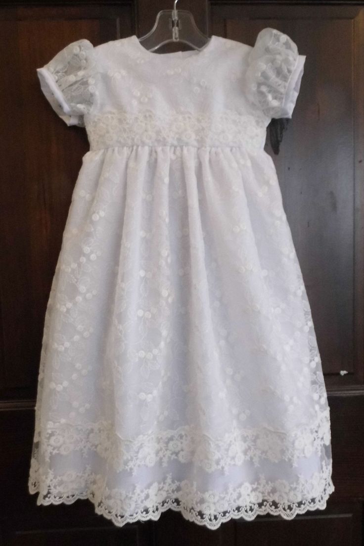 WOW! Cordelia is an exceptional lace blessing, baptism, christening gown! Cordelia is named after a darling little two year old down the street and inspired by a customer, Cordelia is magical! This baby girl lace gown is made of white cotton poplin covered with an exquisite allover embroidered organza lace. The allover lace is accented with another exquisite lace trim on the waist and bottom of the skirt. If you have questions about the organza used please message me! The sleeve is simply lace w Fitted Lace Bodice Dress For First Communion, Baptism Dress With Lace Bodice And Organza Material, Lace Baptism Dress With Lace Bodice, Lace Bodice Baptism Dress, Lace Patchwork Dress For Baptism, Lace Gown With Lace Sleeves For Confirmation, Fitted Baptism Dress With Lace Bodice For First Communion, First Communion Dress With Lace Bodice And Organza, First Communion Gown With Lace Sleeves