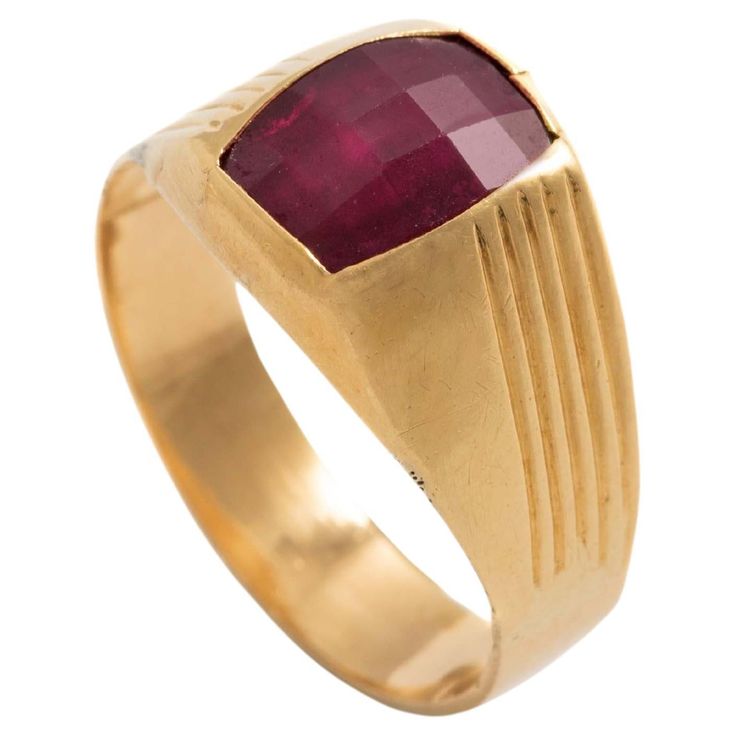 18K yellow gold ring centered by a red stone. Size: 59. Gross weight: 3.77 grams. Yellow Gold Ruby Signet Ring With Polished Finish, Gold Ruby Signet Ring With Polished Finish, Heirloom Ruby Signet Ring In Yellow Gold, Heirloom Yellow Gold Ruby Signet Ring, Formal Ruby Signet Ring In Fine Jewelry Style, Fine Jewelry Ruby Signet Ring For Formal Occasions, Gold Ruby Signet Ring For Formal Occasions, Modernist 14k Gold Ring For Formal Occasions, Ruby Signet Ring Fine Jewelry For Formal Events