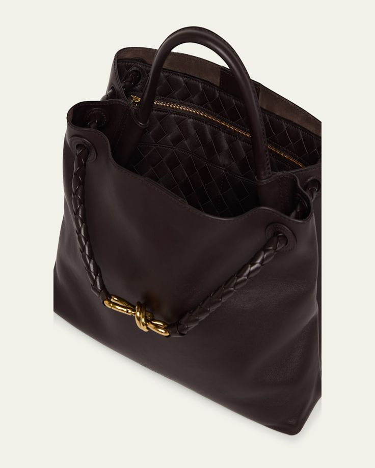 Bottega Veneta "Andiamo" tote bag in silky calf leather     Top handle     Sliding shoulder strap with knot hardware accent     Can be worn as a top handle or shoulder bag     Open top with magnetic closure     Interior, one zip pocket and two slip pockets     Lining: Suede    Feet protect bottom of bag     Approx. 9.8"H x 12.5"W x 4.3"D    Made in Italy Luxury Formal Hobo Bag With Round Handle, Elegant Satchel Shoulder Bag With Rolled Handles, Luxury Hobo Bag With Round Handle For Formal Occasions, Luxury Hobo Bag With Round Handle For Formal Events, Designer Satchel With Rolled Handles For Formal Occasions, Designer Satchel With Rolled Handles For Formal Events, Designer Tote Hobo Bag For Office, Designer Hobo Tote Bag For Office, Timeless Top Handle Hobo Bag