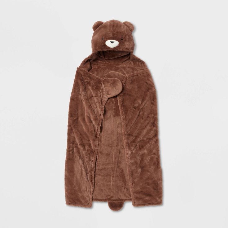 a brown teddy bear coat on a white background with the hood pulled up to show it's face