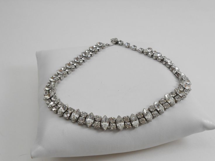 Beautiful sparkling clear rhinestone set into a silver tone metal, This lovely Marked WEISS necklace has a hook style clasp. Perfectly splendid vintage necklace!! 15 x .25 inch Vintage Silver Diamond Necklace, Vintage Silver Sparkling Necklace, Vintage Silver Diamond Necklace Gift, Silver Jeweled Necklaces For Vintage Events, Silver Necklaces With Sparkling Stones For Vintage Events, Silver Jeweled Necklace For Vintage Events, Silver Necklaces With Jewels For Vintage Events, Vintage Silver Diamond Necklace For Formal Occasions, Vintage Silver Diamond Necklace For Evening