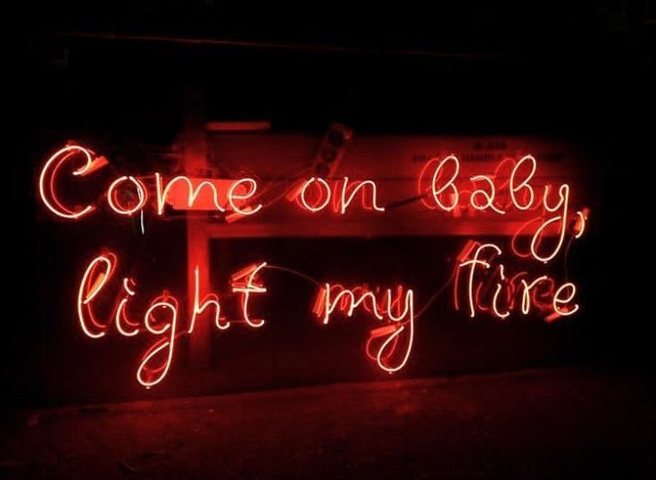 a neon sign that says, come on baby light my fire