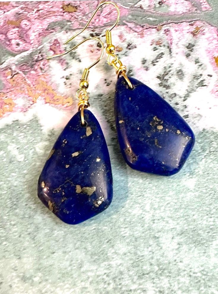 Lapis Lazuli Earrings ☀️ These Earrings are deep blue in color with pyrite....  the Earrings measure approximately 2.2 inches long with Gold Plated ear wires...  the colors may change slightly depending upon the light... - Lapis Lazuli  32mm x 20mm Lapis Lazuli is said to provide self-awareness and encourages clarity and creativity... 🌻 Visit our Etsy Shop for more items... https://www.etsy.com/shop/CrystalHavenDesign 🌻 Blue Lapis Lazuli Teardrop Earrings, Blue Lapis Lazuli Drop Earrings, Blue Teardrop Lapis Lazuli Earrings, Gold Lapis Lazuli Nickel-free Earrings, Nickel-free Gold Lapis Lazuli Earrings, Gold Lapis Lazuli Drop Earrings, Gold Lapis Lazuli Pierced Earrings, Gold Pierced Earrings With Lapis Lazuli, Blue Lapis Lazuli Earrings For Gift