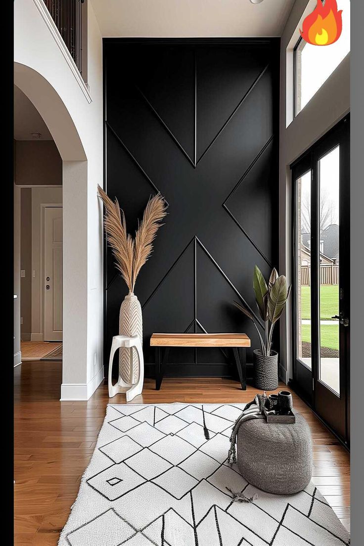 a living room with black walls and white rugs on the wooden floor, large plant in vase next to bench