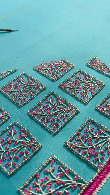 a table topped with lots of different types of beading on top of blue cloth