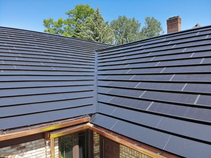 the roof of a house with solar panels on it