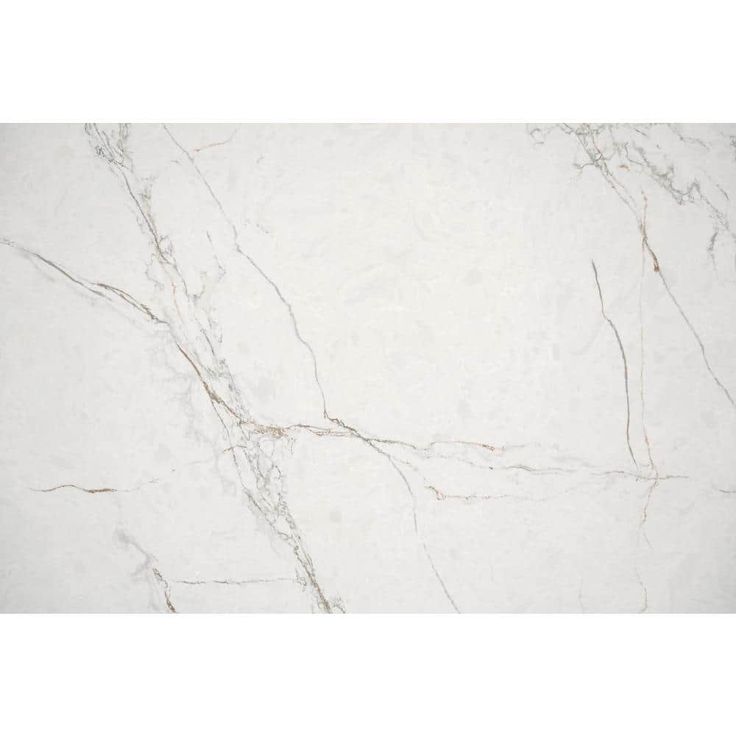 a white marble tile with brown veining on the edges and an interesting pattern in the middle